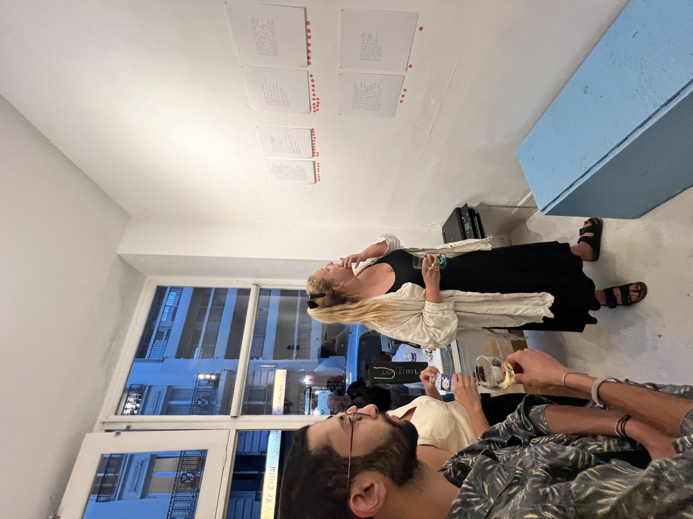 Side-by-side human and machine poems displayed for audience voting