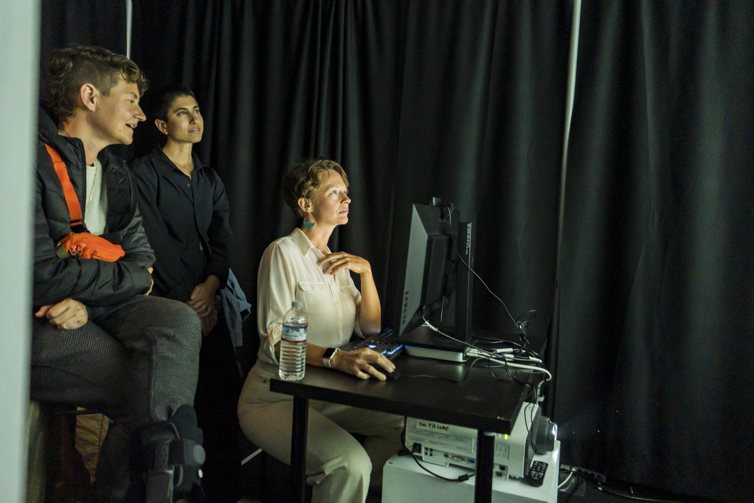 Close-up of the performer behind the desk during the durational piece