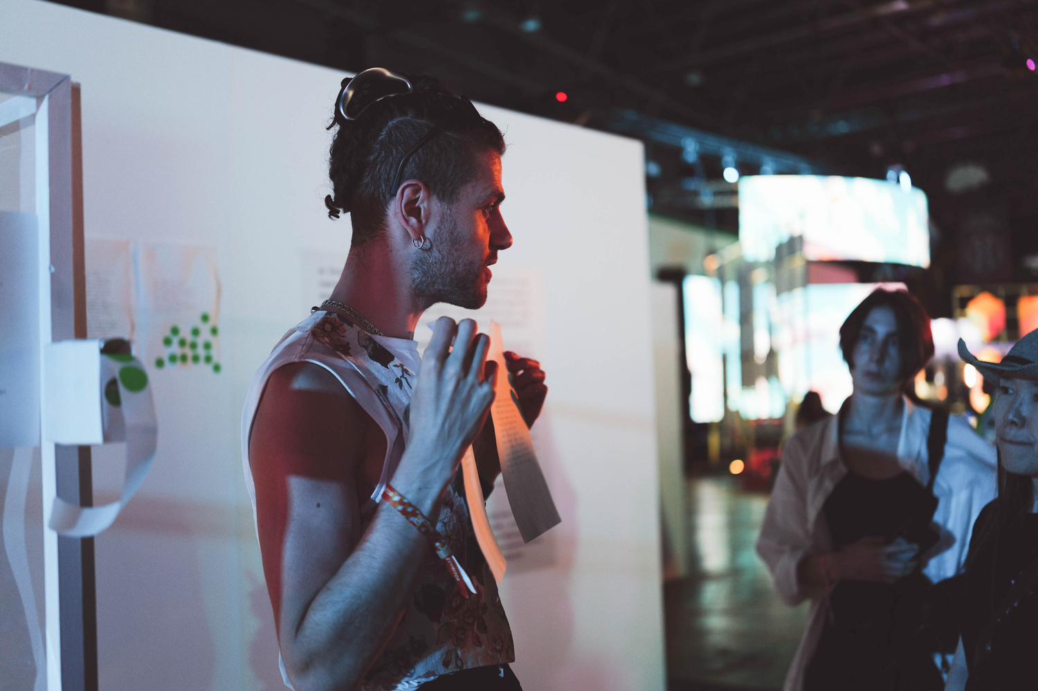 Gallery installation view with printed poems displayed on walls