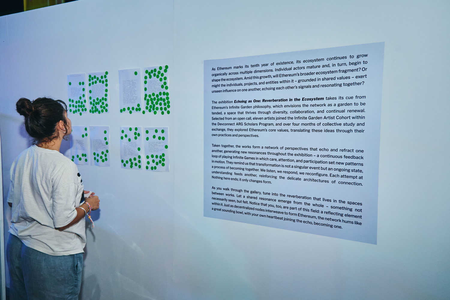Audience viewing the performance from outside the glass cube