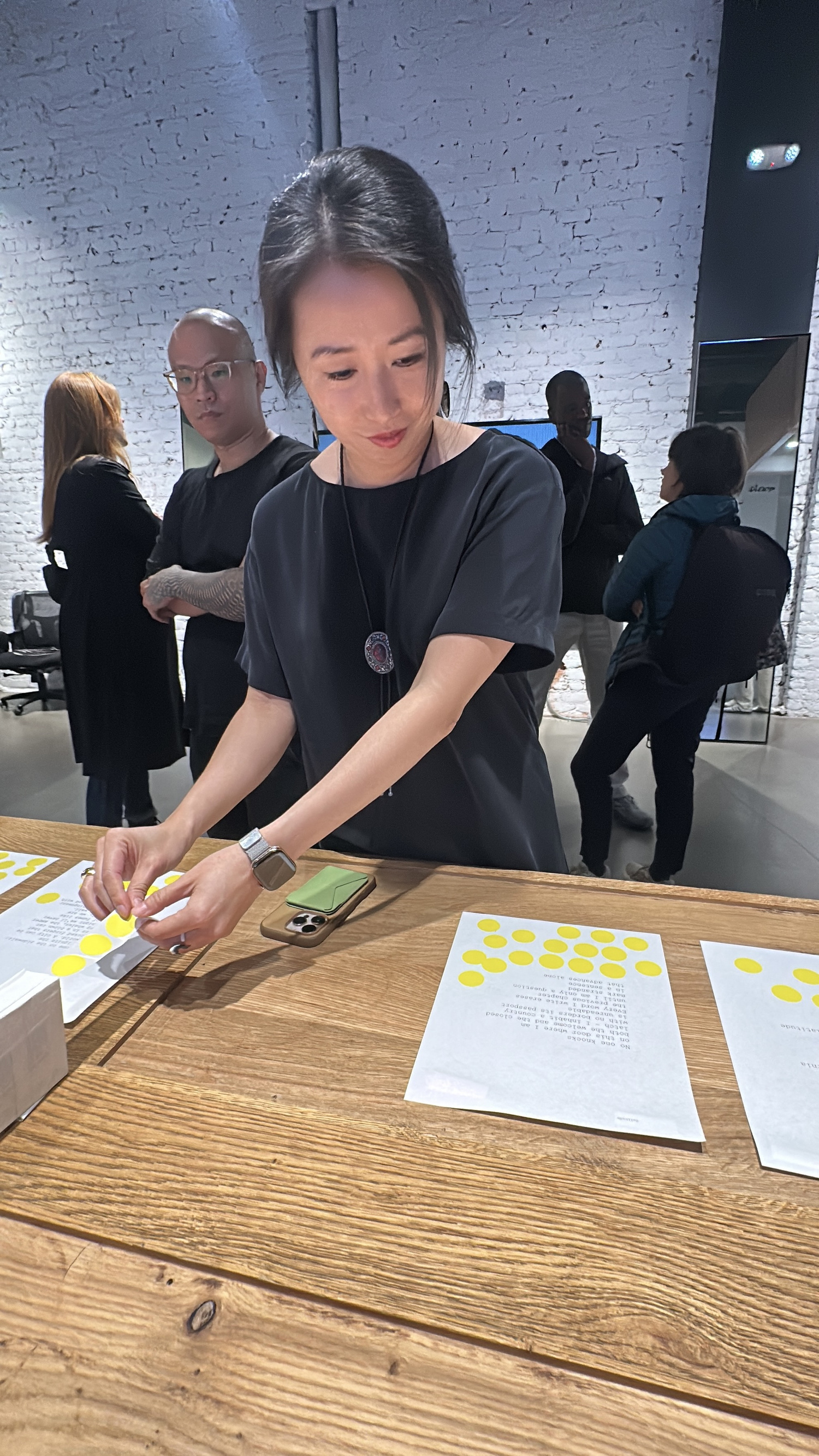 Halim writing behind a reflective screen with a timer showing 24:45