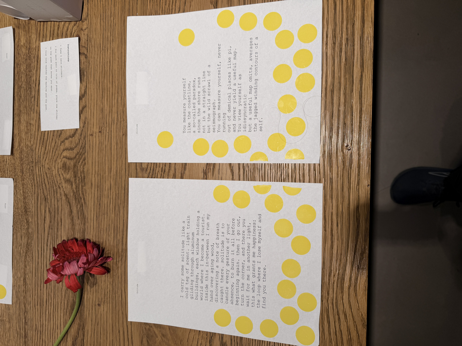 Typed poems with voting stickers accumulating on the pages