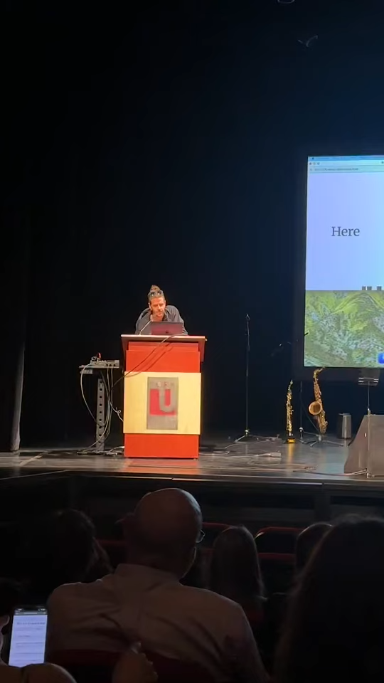 Live performance with audience prompts displayed on screen